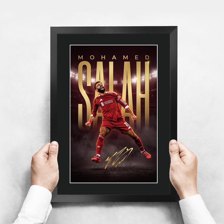 The framed print held up to show its size