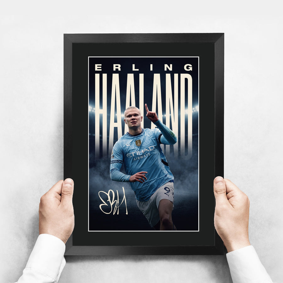 The framed print held up to show its size