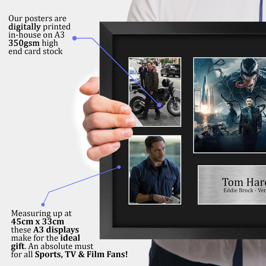 The framed print held up to show its size